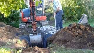 Digger working on soak pit.MTS