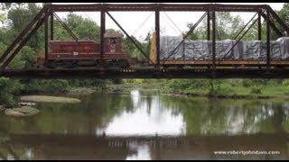 Classic locomotive Lehigh Valley #112 and train casts a reflection in the Raritan River