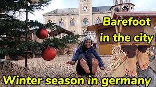 Barefoot in the city in germany / Winter season / Christmas market soon to open / Window shopping