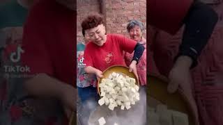 Grandma cooking spicy mince pork tofu