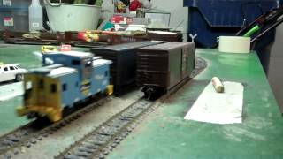 HD: NS GP60 7140 leads a local manifest on HO scale.