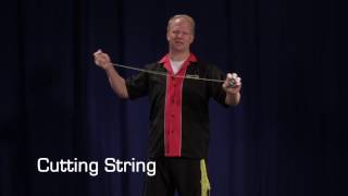 Cutting a yo-yo string to the correct length.