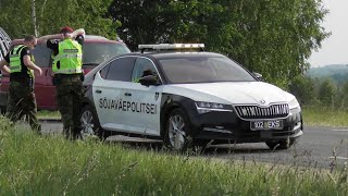 Estonian Military Police escorts British heavy equipment transport vehicles