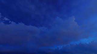 ( CGI 4k Stock Footage ) Dark blue night clouds on stary sky time lapse seamless loop