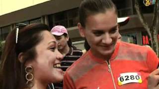 Yelena Isinbayeva runs with the torch at Orchard Road