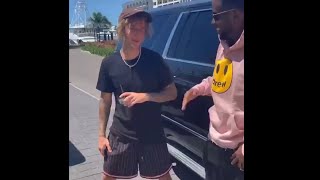 P Diddy does a pat down on Justin Bieber wearing his clothing line