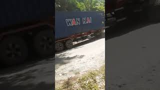 Container Truck Turns Through Extreme Slopes