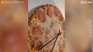 A clock  being made from pizza!!