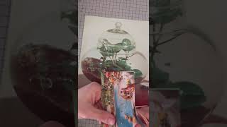 Handmade collage art process. Swimming pool in the bottle garden