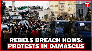 Syrian Rebels Advance: Homs Breached, Protests in Damascus Suburbs