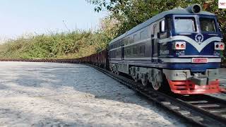 Very Long Toy Train Carrying Mineral Wagons From A Mine On HO Scale Model Railroad