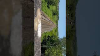 GWR 43xxx and 43xxx pass under exminster overpass with a wave from the driver