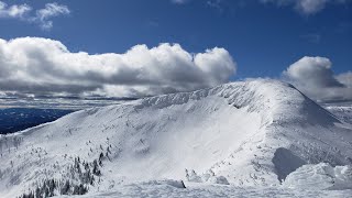 Skiing cliff bowl at Big White on a bluebird day