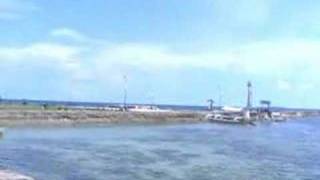 Standing at the sea wall in Baclayon, Bohol, Philippines