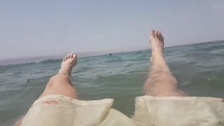 Floating in the Dead Sea (Jordan side) - HD