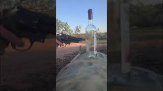 Slow mo glass bottle destruction with revolver #short