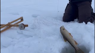 Lake trout/togue fishing through the ice