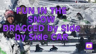 Sled Riding pulled by side by side car