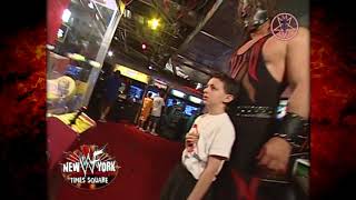 Kane Helps a kid win a prize at wwf New York 6/18/01