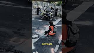 This protester glued his hand to the ground!