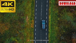 🎁4K Drone tracking black car driving on empty highway along autumn forest | DAILY NATURE FOOTAGE