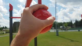 Grabbing Balls at Civic Park Adult Fitness Playground in Kirkland Lake