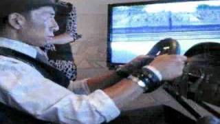 Stars Try Out the Motion Pro II Racing Simulator