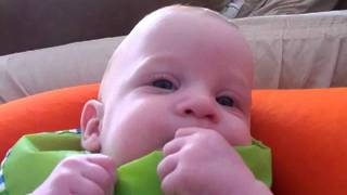 Baby laughing with his mother