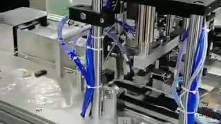 Automatic mask machine with an earloop welding table