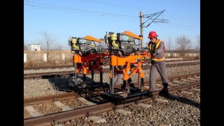 Rail ballast tamping machine