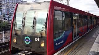 DLR trains departing Stratford and Poplar