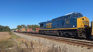 Csx Q416 with a fresh CM44AC and a red caboose at jones crossing