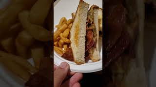 Elvis sandwich (peanut butter, banana and bacon)serve with fries.