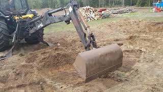 Valmet 30 and Valmet 6800 twin trac planning bucket