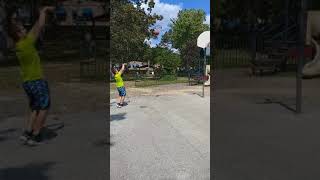 Youngster shooting 3 point,