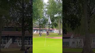 Over a bunker, down slope landing and the pin close to the fringe.