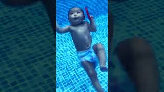 cute baby swimming in the pool