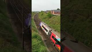 #Multi coloured Pendolino 390119 seen at Bay Horse south of Lancaster #train