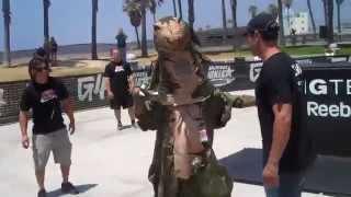 Godzilla running the American Ninja Warrior Course for Attack of the Show