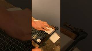 Testing an antique paper cutter.