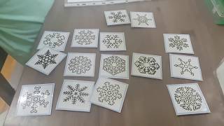 Dea doing visual discrimination activity - snowflakes matching