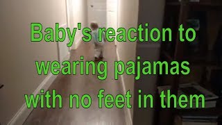 a funny video of a toddler wears pajamas with no feet in them for the first time