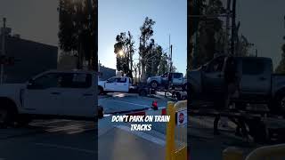 please don't park on train tracks