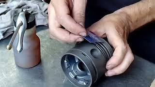 Easy way to put on piston rings by hand without tools