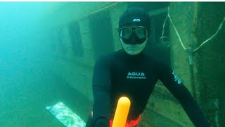 Underwater train car. Girl dives 10 meters underwater