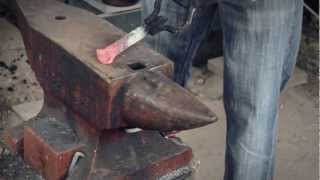 Re: "Forging a plant hanger from a railroad spike."