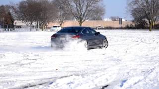 2015 Genesis 5.0 drifting in the snow.