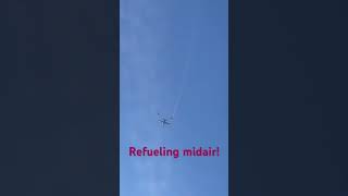 Refueling midair is amazing to witness. Looks like they are still practicing. Chem trails for real.